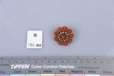 BROOCH: FLOWER SHAPED CLUSTER OF ORANGE BEADS AND PEARLS