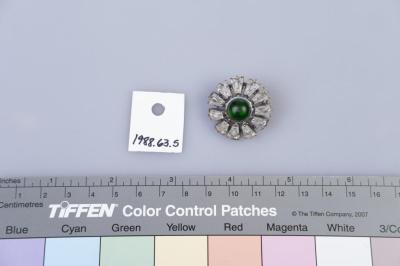 BROOCH: FLOWER WITH GREEN STONE