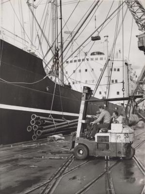 PHOTOGRAPH: METTERS' CAST-IRON PIPES DESTINED FOR SINGAPORE BEING LOADED AT DOCKS