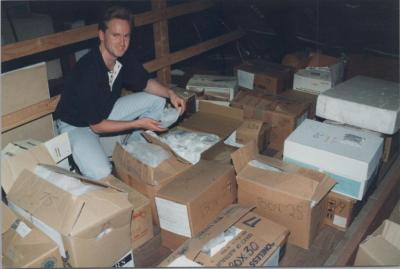 PHOTOGRAPH: STUDENT HANDLING MUSEUM OBJECTS