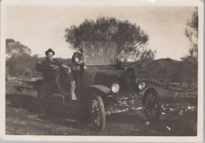 PHOTOGRAPH: TOM HANCOCK SITTING IN HIS TAXI