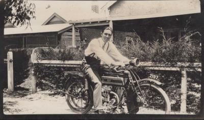 PHOTOGRAPH: HARRY COWAN ON A MOTORBIKE