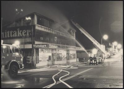 PHOTOGRAPH: FIREMEN FIGHTING FIRE AT WHITTAKERS