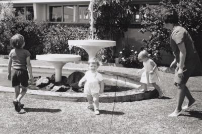 PHOTOGRAPH: HUMES ENTRANCE - CHILDREN IN AREA GRASSED AREA WITH FOUNTAINS AND POND