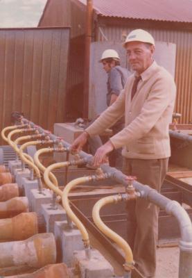 PHOTOGRAPH: HUMES WORKERS WITH HUMES PIPES