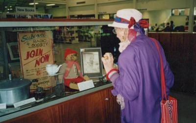 PHOTOGRAPH: CLARE HUGHES VIEWING MUSEUM DISPLAY AT SUBIACO LIBRARY