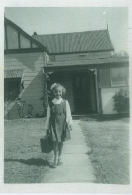 PHOTOGRAPH: LORI SCHIAVITTI IN FRONT OF HOUSE OR SCHIAVITTA