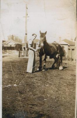 PHOTOGRAPH (DIGITAL): REECE THOMAS NICHOLSON WITH A HORSE