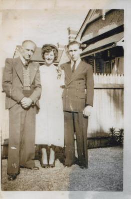 PHOTOGRAPH (DIGITAL): TWO MEN AND A WOMAN IN THE FRONT GARDEN OF 111 HAY STREET