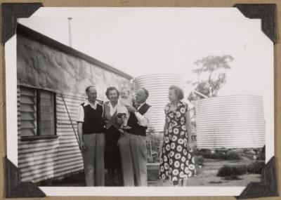 PHOTOGRAPH (DIGITAL): GROUP PHOTO IN FRONT OF WATER TANKS, MECKERING FROM CONGDON FAMILY ALBUM