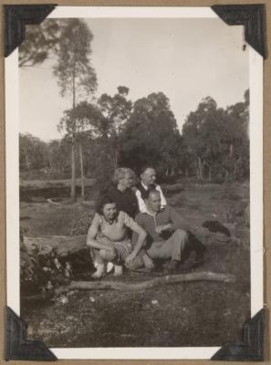 PHOTOGRAPH (DIGITAL): GROUP PHOTO SITTING ON A LOG, FROM CONGDON FAMILY ALBUM