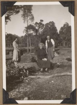 PHOTOGRAPH (DIGITAL): GROUP PHOTO BY A LOG, FROM CONGDON FAMILY ALBUM