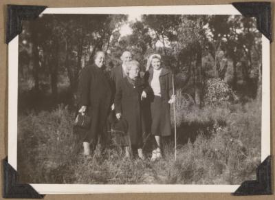 PHOTOGRAPH (DIGITAL): GROUP PHOTO IN A GRASS CLEARING, FROM CONGDON FAMILY ALBUM