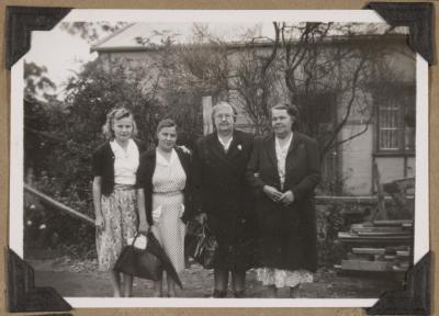 PHOTOGRAPH (DIGITAL): FOUR WOMEN STANDING IN FRONT OF A HOUSE, FROM CONGDON FAMILY ALBUM