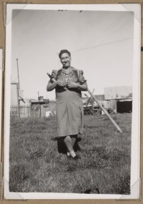 PHOTOGRAPH (DIGITAL): WOMAN WITH BOTTLES AND GLASSES, FROM CONGDON FAMILY ALBUM