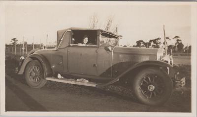 PHOTOGRAPH: WOMAN IN A MOTOR VEHICLE