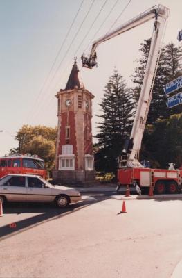 PHOTOGRAPH (DIGITAL): FALLEN SOLDIERS MEMORAL CLOCK TOWER, CLEANING OF THE CLOCK, 1988