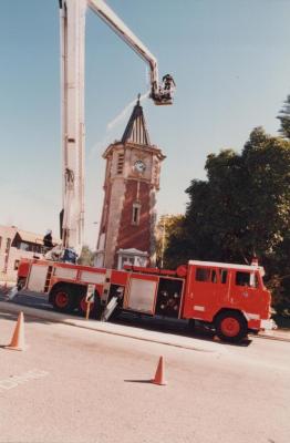 PHOTOGRAPH (DIGITAL): FALLEN SOLDIERS MEMORAL CLOCK TOWER, CLEANING OF THE CLOCK, 1988