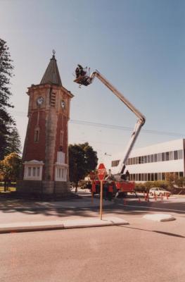 PHOTOGRAPH (DIGITAL): FALLEN SOLDIERS MEMORAL CLOCK TOWER, CLEANING OF THE CLOCK, 1988