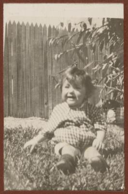 PHOTOGRAPH (DIGITAL): THELMA CONGDON SITTING ON THE GRASS, FROM CONGDON FAMILY ALBUM