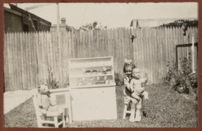 PHOTOGRAPH (DIGITAL): THELMA CONGDON PLAYING IN A GARDEN, FROM CONGDON FAMILY ALBUM