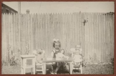 PHOTOGRAPH (DIGITAL): THELMA CONGDON WITH DOLLS IN A GARDEN, FROM CONGDON FAMILY ALBUM