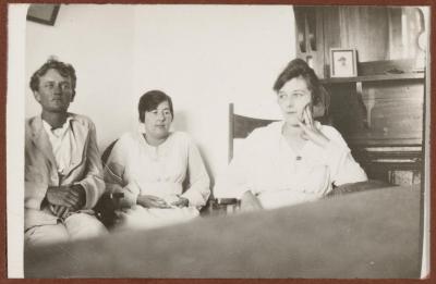 PHOTOGRAPH (DIGITAL): GROUP SITTING BY A FIREPLACE, FROM CONGDON FAMILY ALBUM