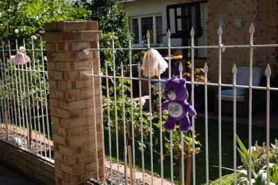 PHOTOGRAPH (DIGITAL): COVID 19 MESSAGES OF HOPE, TEDDY BEAR ON A FENCE, JUNE 2020