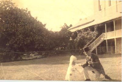 SHARKEY COLLECTION - CHILD AND ADULTS ON TENNIS COURT