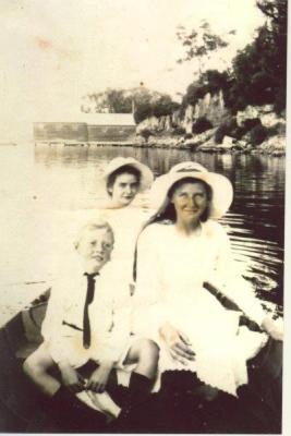 SHARKEY COLLECTION - GROUP IN DINGHY NEAR SCOTCH COLLEGE BOAT SHED