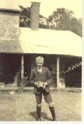 SHARKEY COLLECTION - LAD WITH CAMERA AT REAR OF HOUSE
