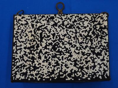 Handbag with plastic beads