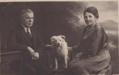 POSTCARD: UNKNOWN COUPLE AND DOG, FROM ALBUM 1, THELMA GREEN COLLECTION