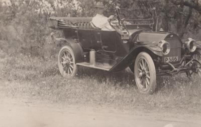 POSTCARD: MAN DRIVING CAR, FROM ALBUM 1, THELMA GREEN COLLECTION