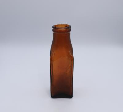 BOTTLE, BROWN GLASS - SWAN PRODUCTS