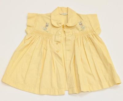 DRESS: BABY DRESS, PALE YELLOW, COLLARED WITH SMOCKING AND EMBROIDERED RABBITS ON CHEST