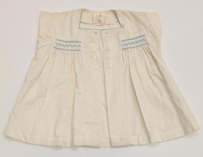 BABYWEAR: DRESS AND BLOOMERS, OFF WHITE COTTON WITH BLUE SMOCKING